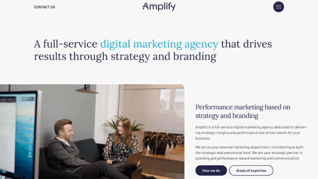 Amplify homepage hero section with bold headline ‘A full‑service digital marketing agency that drives results’ and founder photo in the background.